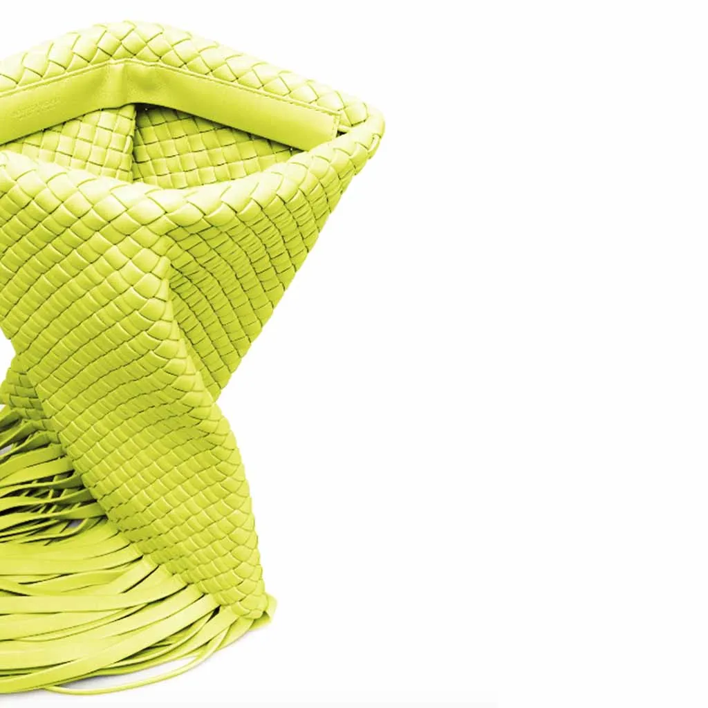 The Alaia Tassel Weave Clutch Bag in chartreuse